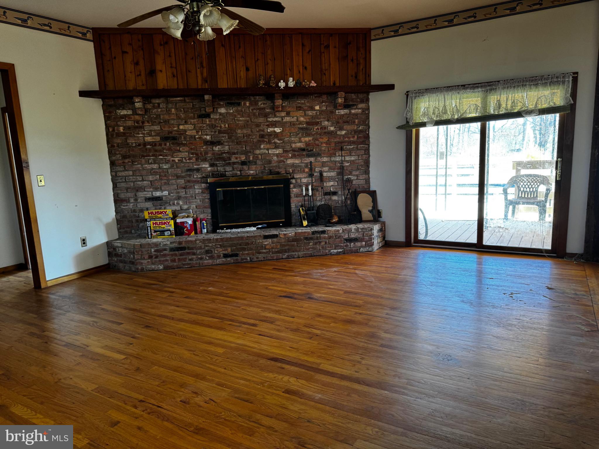 18 Province Line Road New Egypt, NJ 08533 - Photo 4 of 15 a living room with hard wood floors and a fireplace