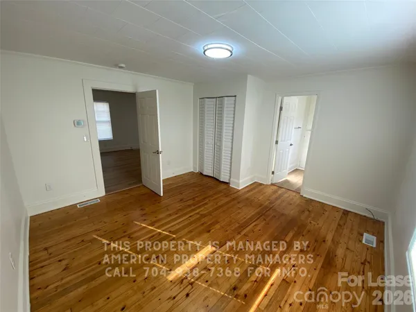a bedroom with a bed and a cabinets