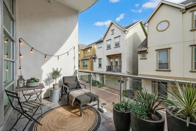 a bathroom with a granite countertop sink mirror and a bathtub