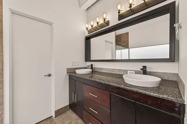 an aerial view of a city with parking