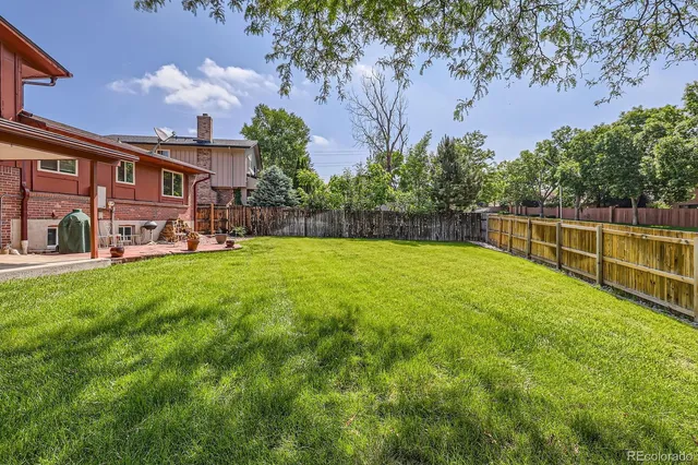 a view of a house with a yard porch and sitting area