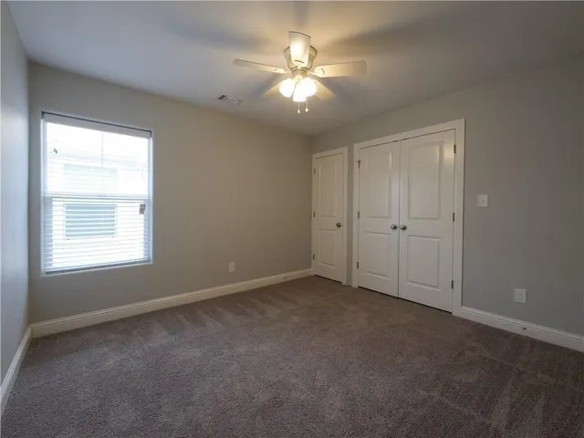a kitchen with stainless steel appliances granite countertop a sink and a stove