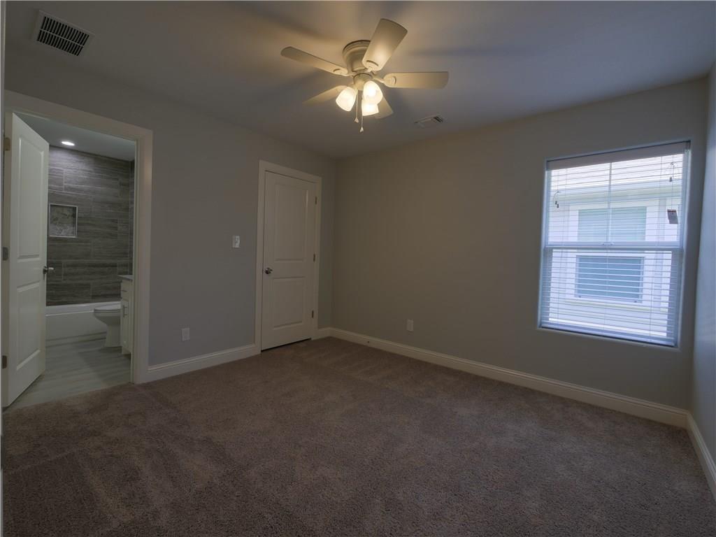 605 East Carter Street Sherman, TX 75090 - Photo 4 of 10 an empty room with closet and a ceiling fan