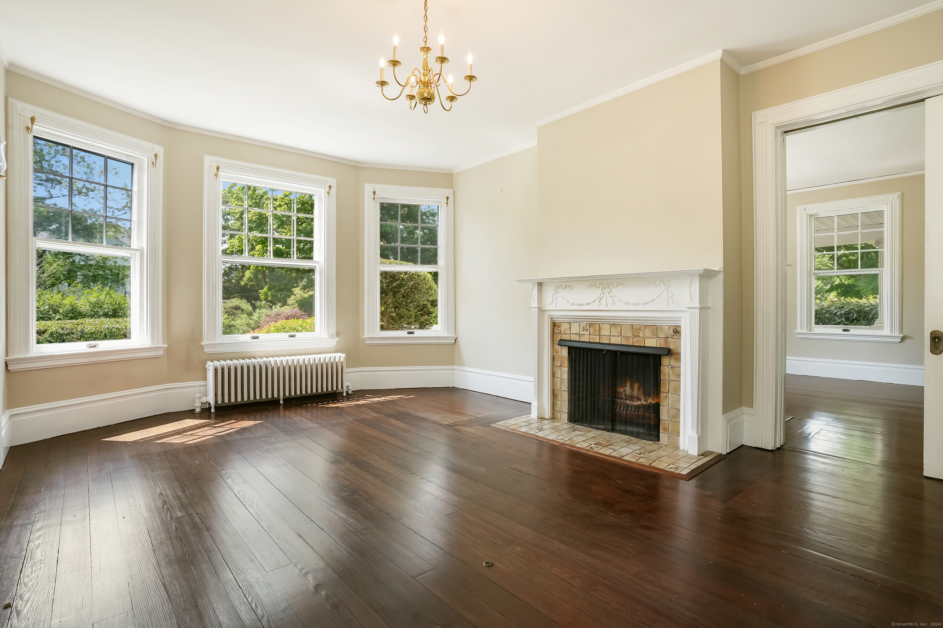 56 East Ridge Road Ridgefield, CT 06877 - Photo 12 of 38 a view of an empty room with wooden floor and a window