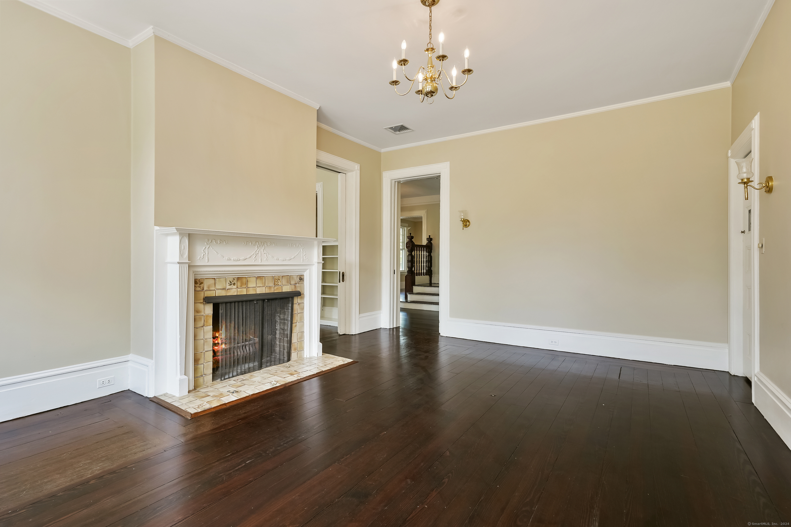 56 East Ridge Road Ridgefield, CT 06877 - Photo 13 of 38 an empty room with wooden floor fireplace and windows
