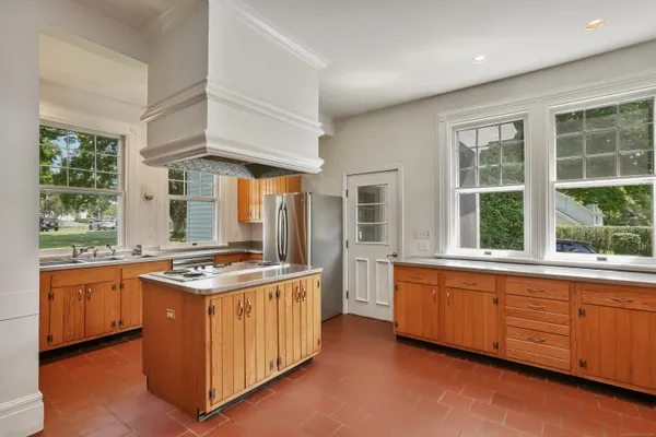 a kitchen that has a sink and a stove