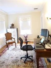 a workspace with furniture and a window