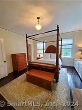 56 East Ridge Road Ridgefield, CT 06877 - Photo 33 of 38 a bedroom with furniture and a window