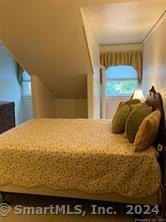 56 East Ridge Road Ridgefield, CT 06877 - Photo 37 of 38 a bedroom with a bed and a window