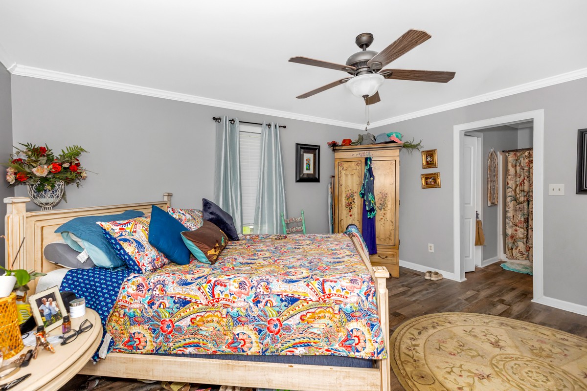 113 Elliot Road Ardmore, TN 38449 - Photo 12 of 25 a bedroom with a bed and a dresser in it