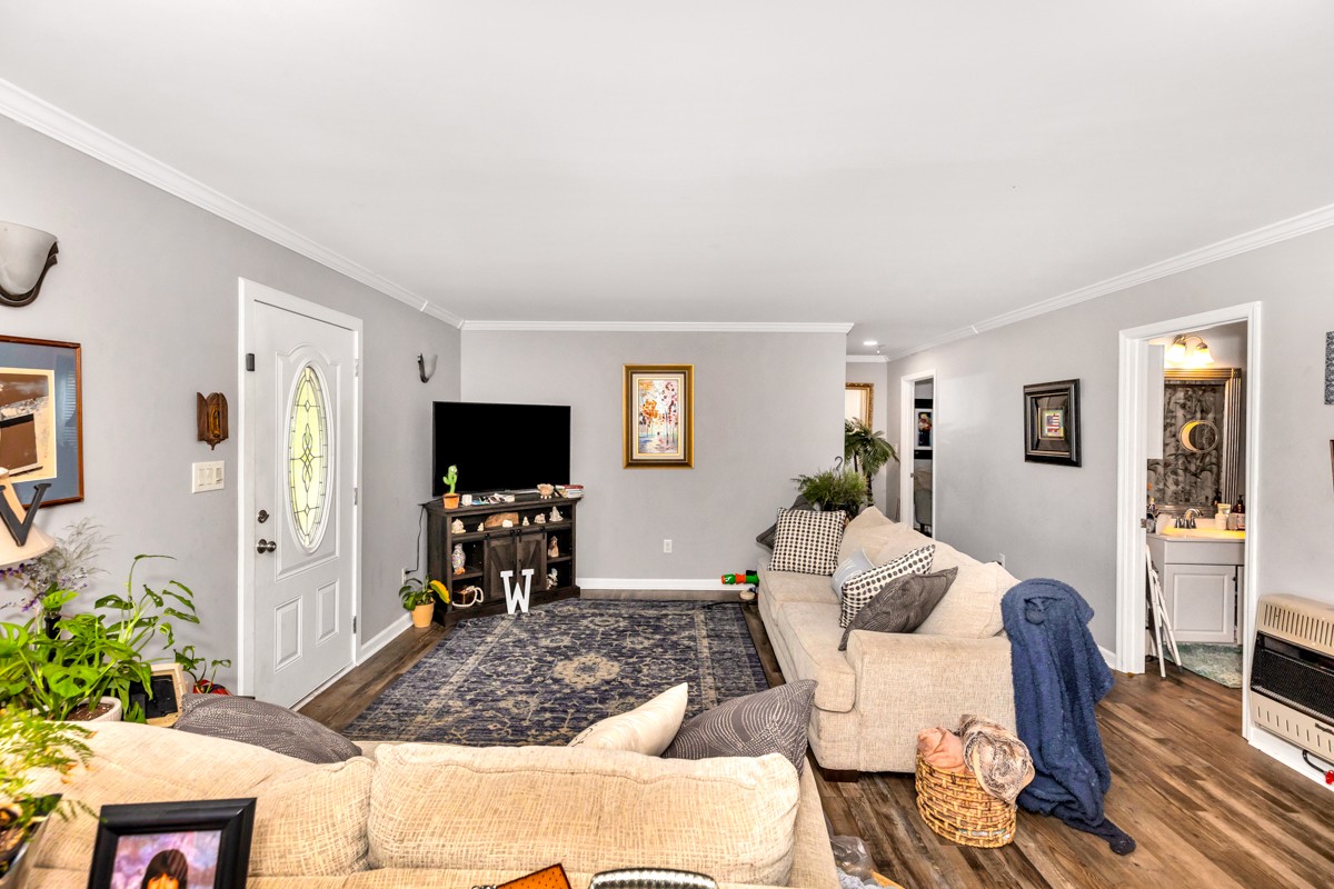 113 Elliot Road Ardmore, TN 38449 - Photo 5 of 25 a living room with furniture and a flat screen tv