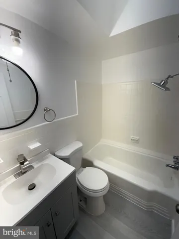 a bathroom with a sink toilet and a bathtub