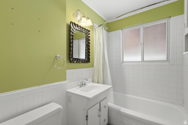 378 West 200 South Bountiful, UT 84010 - Photo 16 of 32 Bathroom featuring a white vanity with integrated sink, chrome faucet, and a wall-mounted mirror with an ornate frame