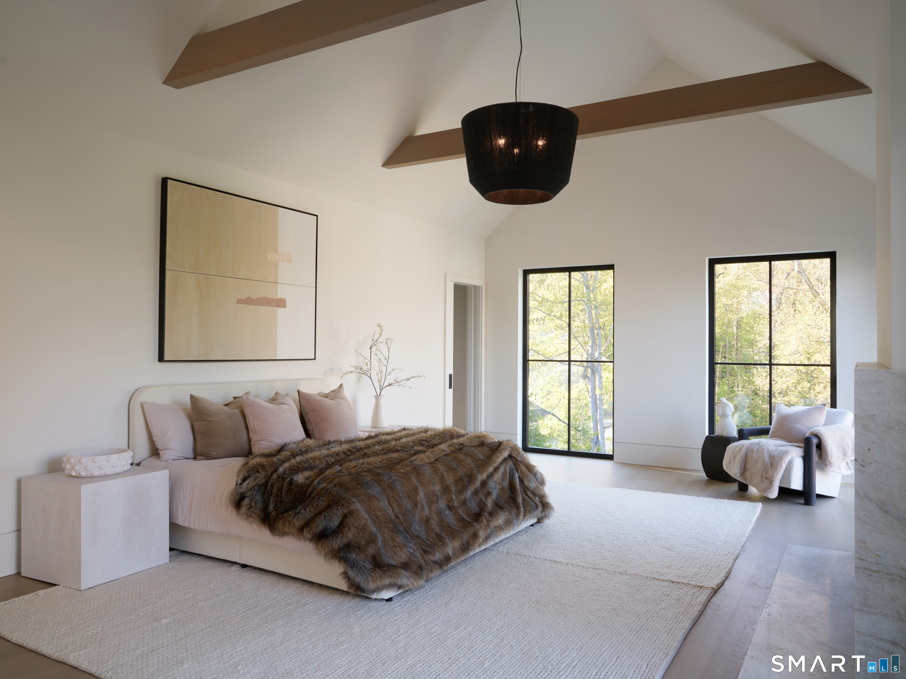 45 Old Farm Road Darien, CT 06820 - Photo 19 of 38 a spacious bedroom with a bed and ceiling fan