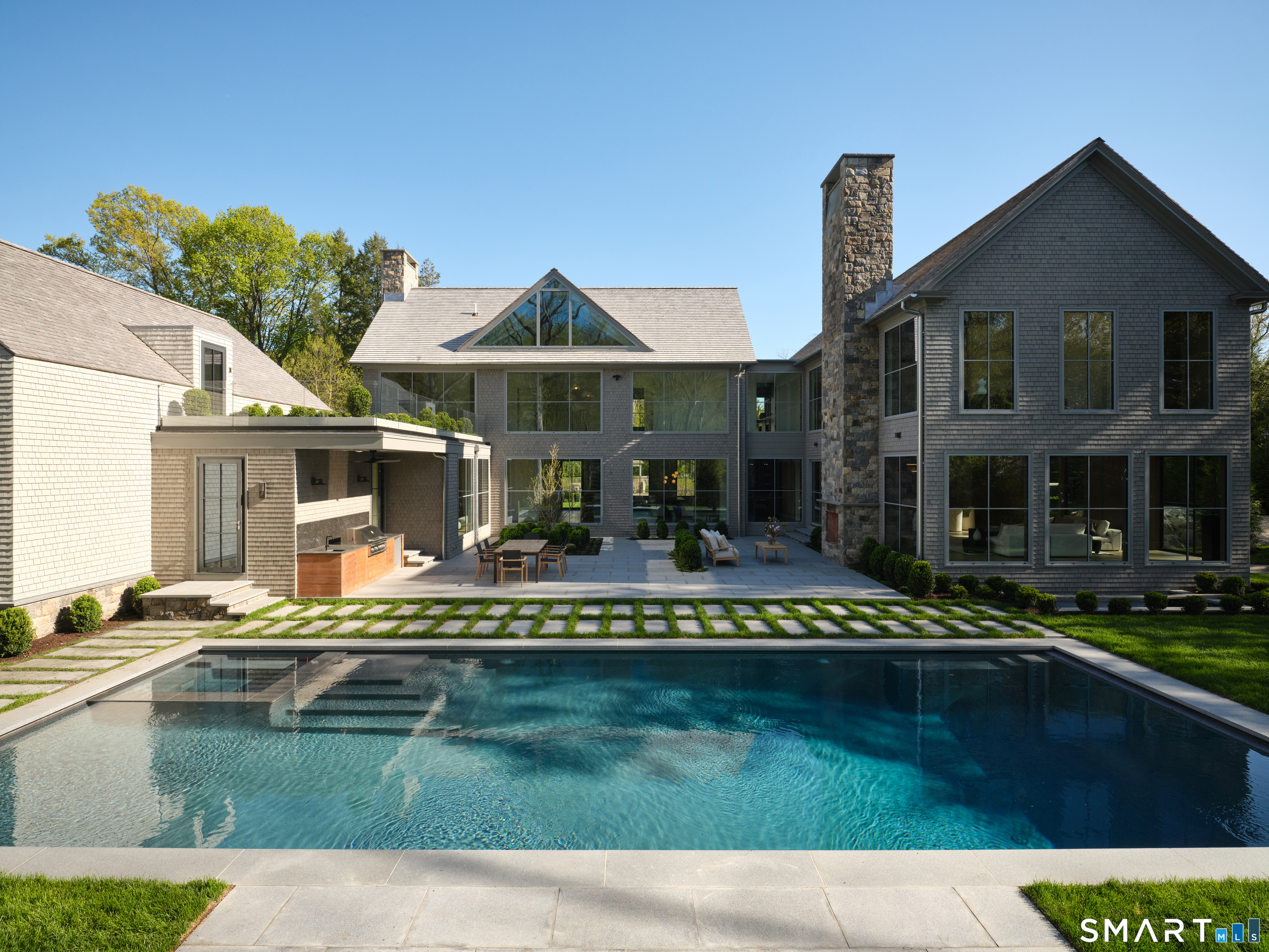 45 Old Farm Road Darien, CT 06820 - Photo 2 of 38 a front view of a house with swimming pool