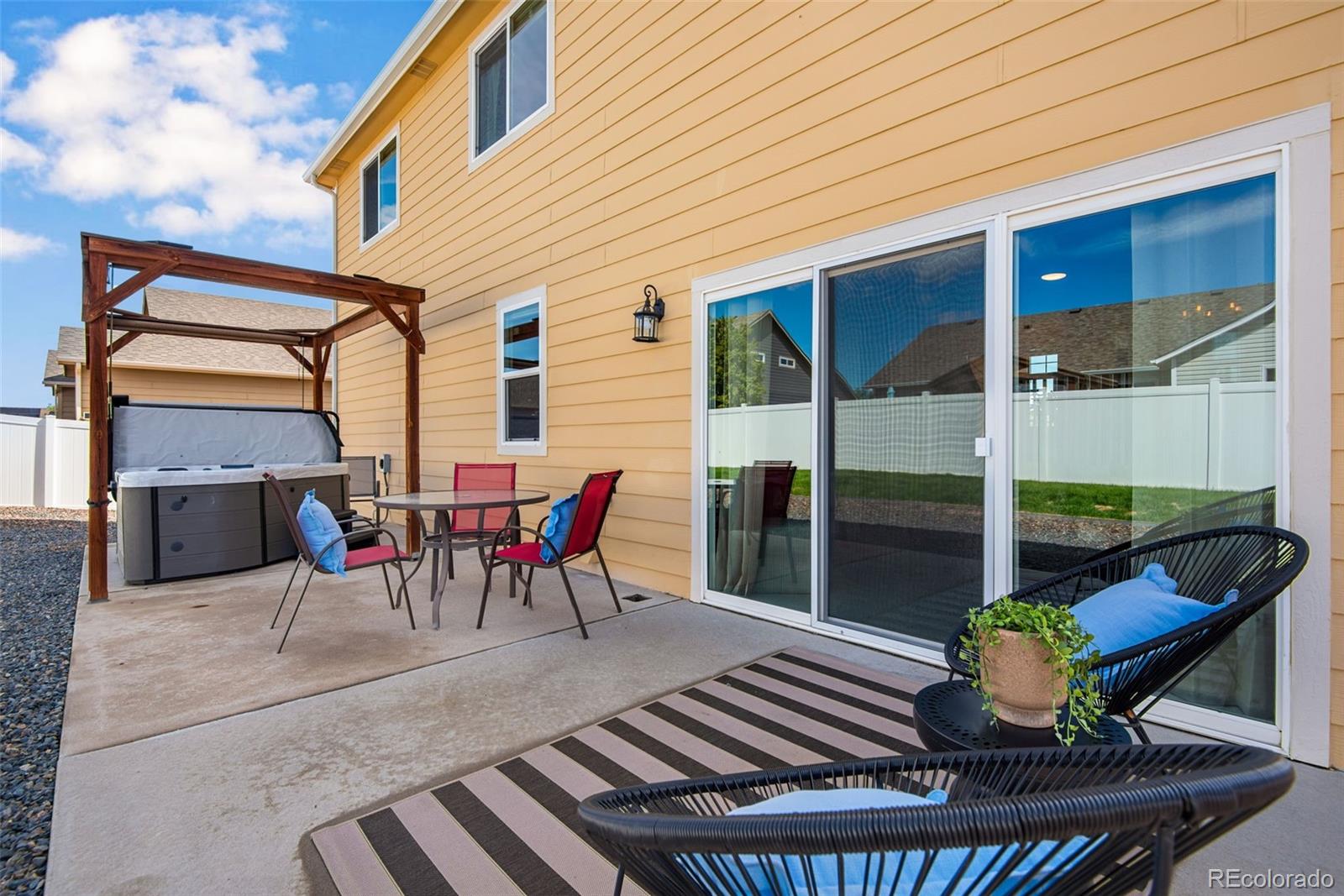 7035 McClellan Road Wellington, CO 80549 - Photo 17 of 43 a view of a chairs and table in the patio
