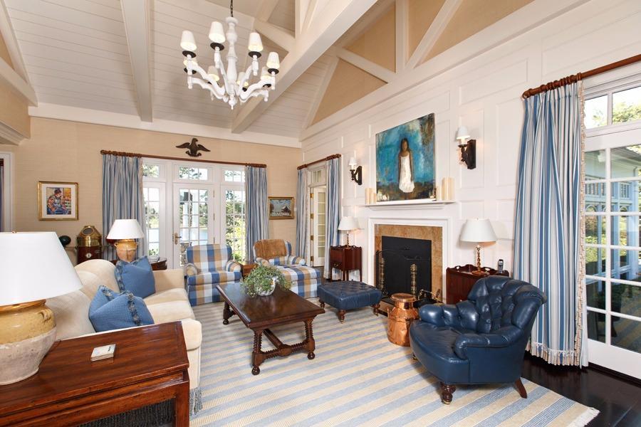 260 North Bay Road Osterville, MA 02655 - Photo 13 of 35 a living room with furniture a chandelier a fireplace and a large window