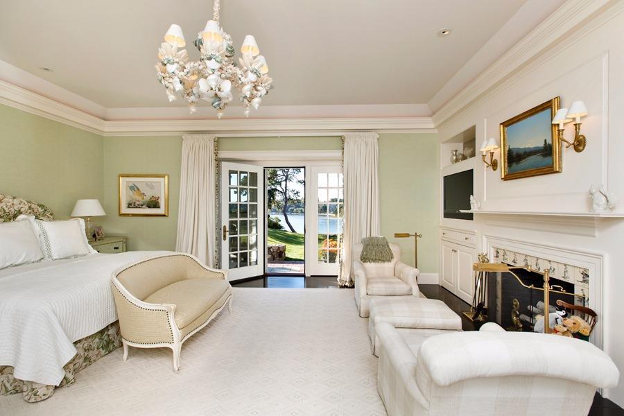 260 North Bay Road Osterville, MA 02655 - Photo 20 of 35 a living room with furniture a fireplace and a flat screen tv