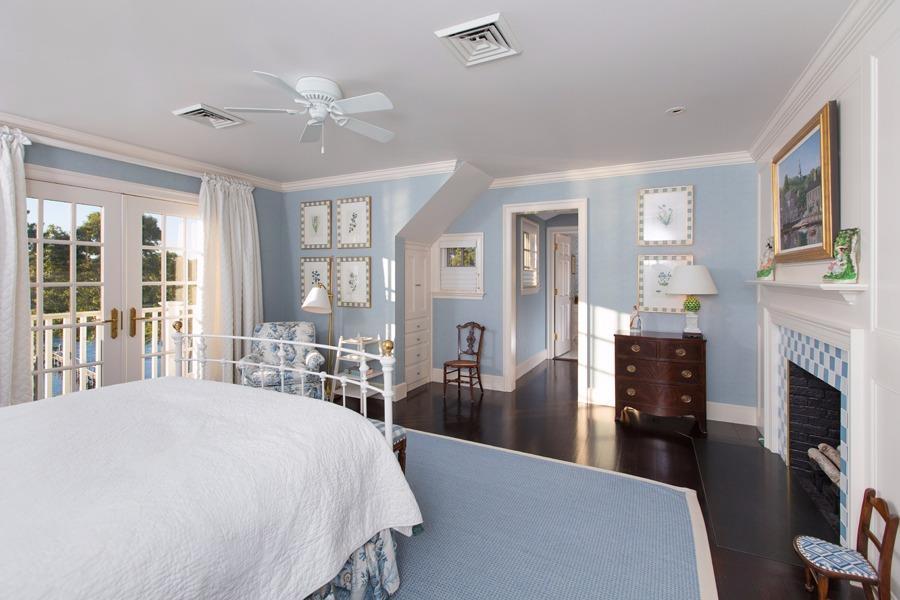 260 North Bay Road Osterville, MA 02655 - Photo 22 of 35 a bedroom with a large bed a flat tv screen and dresser