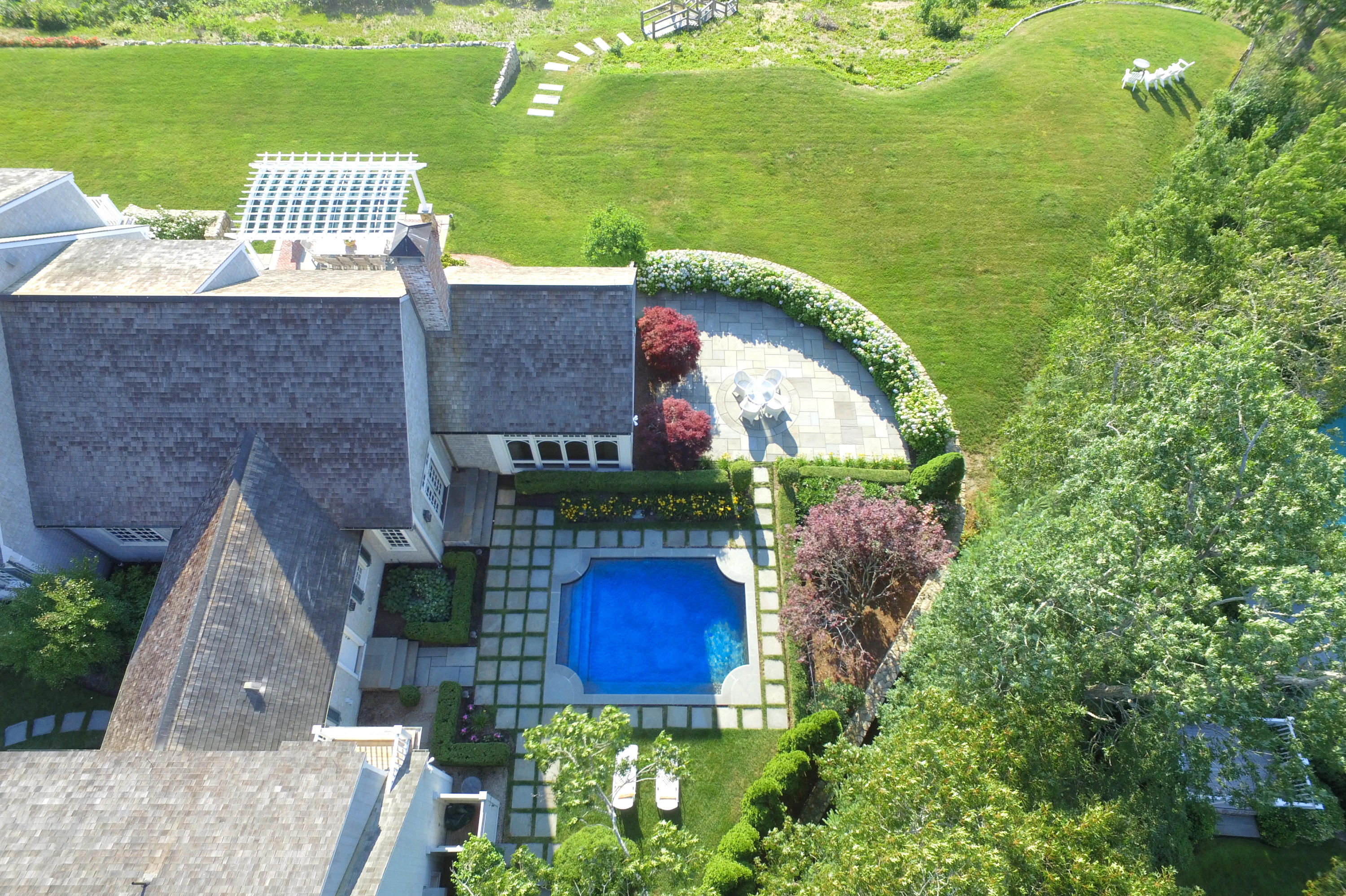 260 North Bay Road Osterville, MA 02655 - Photo 30 of 35 a view of a house with a yard and a garden