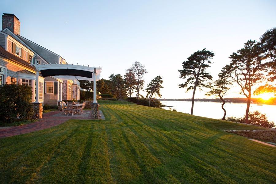 260 North Bay Road Osterville, MA 02655 - Photo 5 of 35 a view of patio with table and chairs and potted plants by side of it