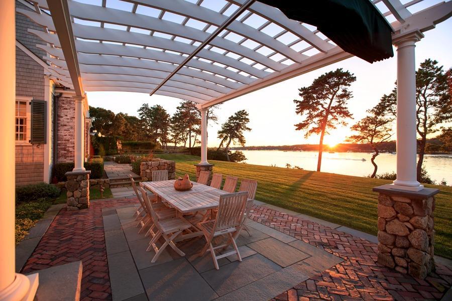 260 North Bay Road Osterville, MA 02655 - Photo 6 of 35 a view of chairs and table in patio with wooden fence