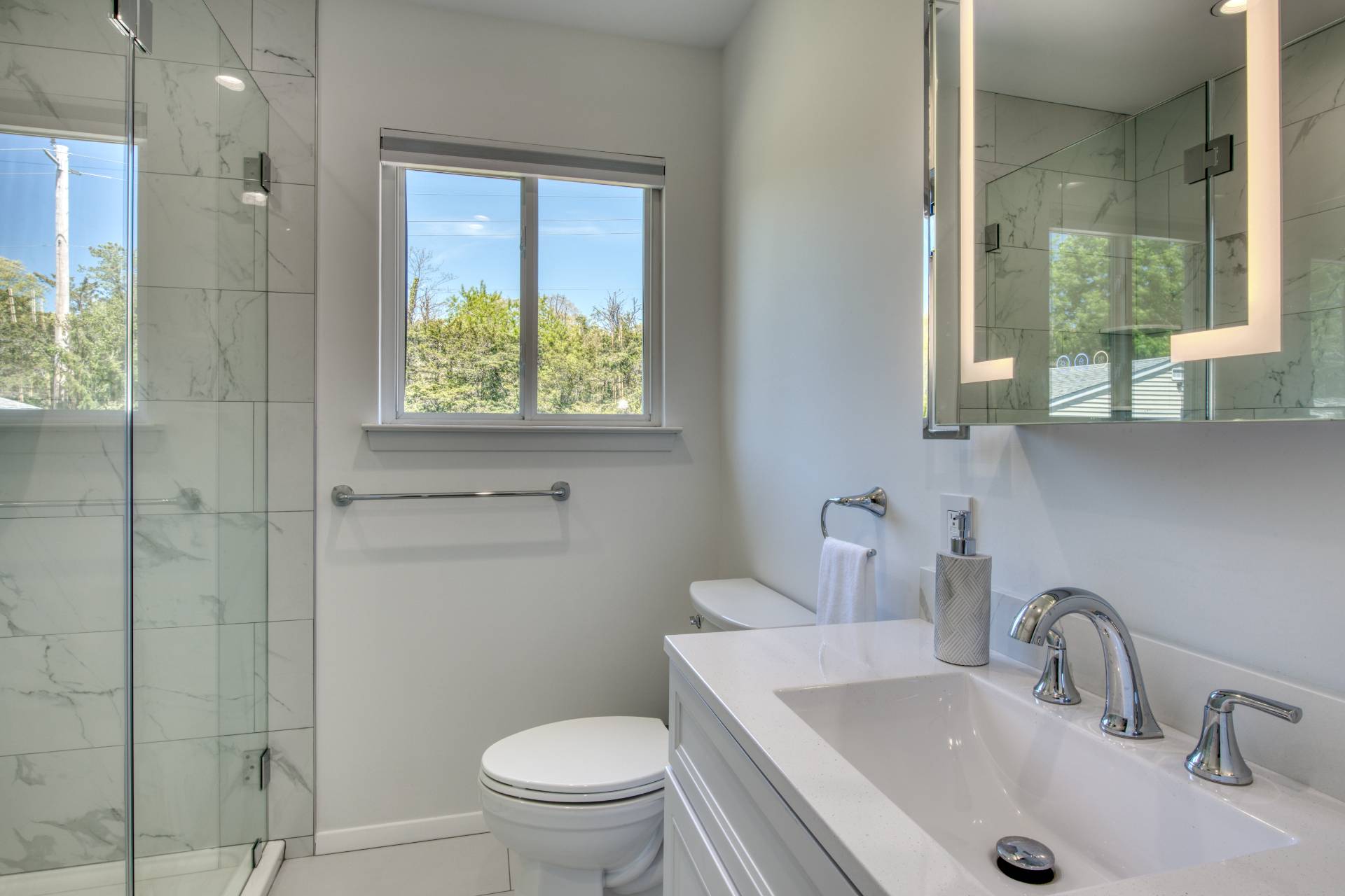 88 Old Country Road East Quogue, NY 11942 - Photo 5 of 10 a bathroom with a toilet sink and window