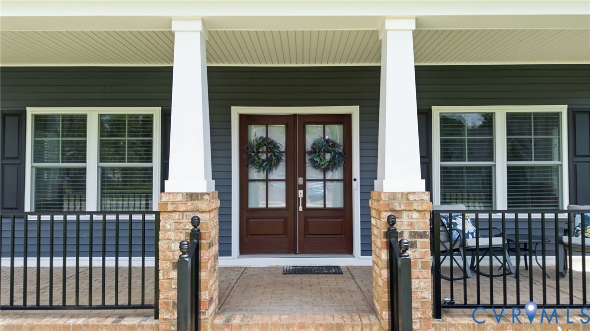 12040 Kenton Ridge Road Ashland, VA 23005 - Photo 42 of 54 Covered front porch featuring brick columns with w
