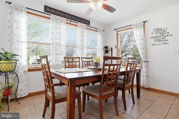 a kitchen with stainless steel appliances granite countertop a refrigerator and a stove