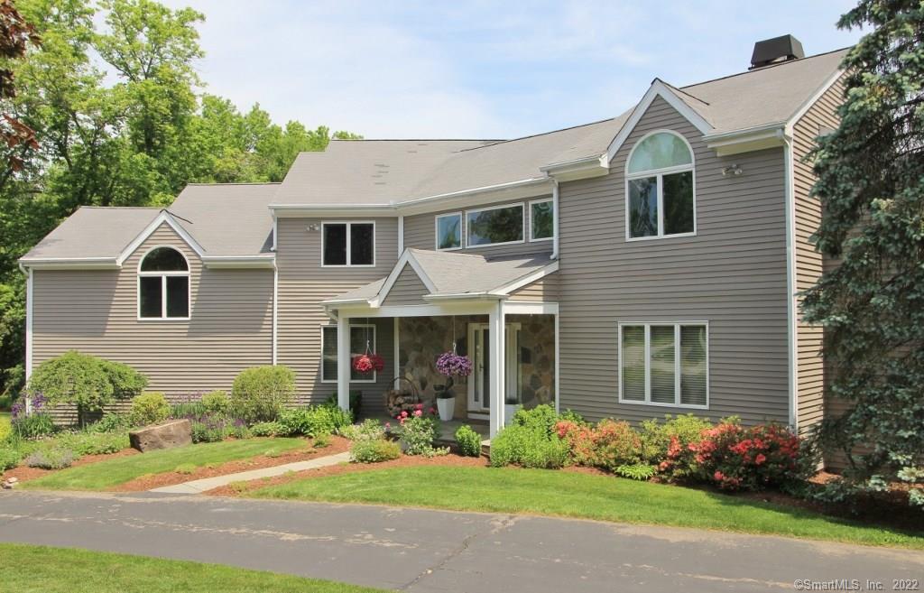 107 Heming Way Stamford, CT 06903 - Photo 1 of 1 a front view of a house with a yard and trees