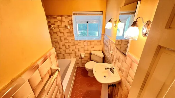 a bathroom with a sink and toilet
