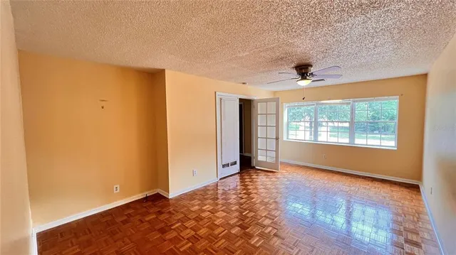 a view of an empty room with a window