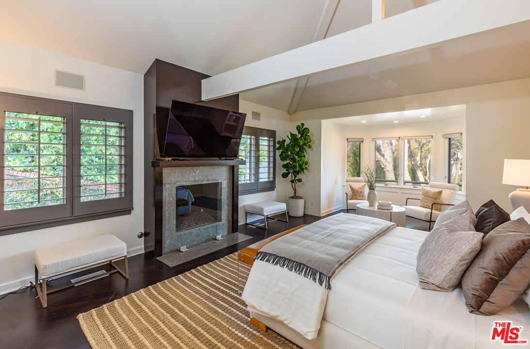 851 Glenmont Avenue Los Angeles, CA 90024 - Photo 14 of 26 a living room with furniture fireplace and flat screen tv
