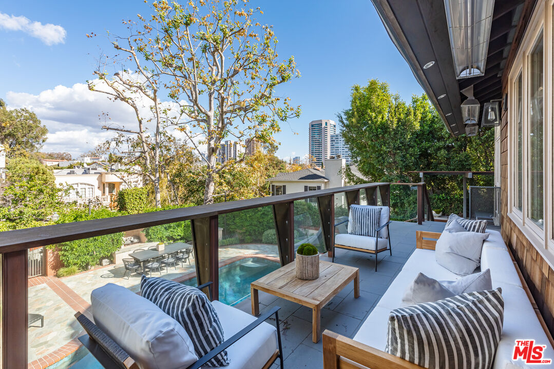 851 Glenmont Avenue Los Angeles, CA 90024 - Photo 16 of 26 a view of balcony with couch and chairs