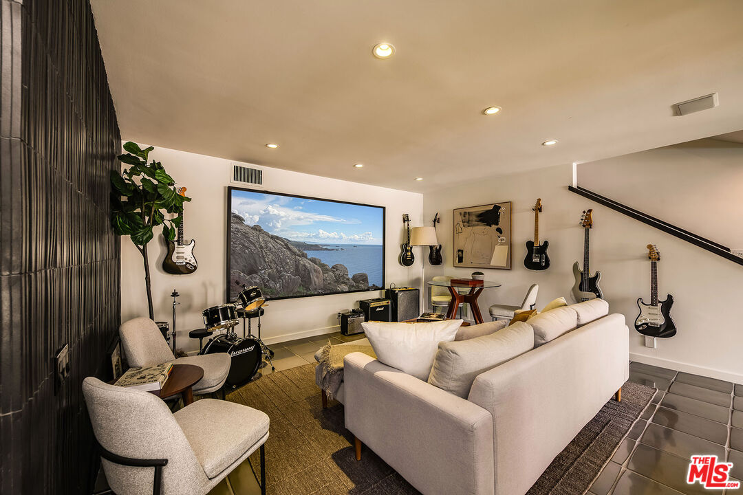 851 Glenmont Avenue Los Angeles, CA 90024 - Photo 19 of 26 a living room with furniture and a flat screen tv