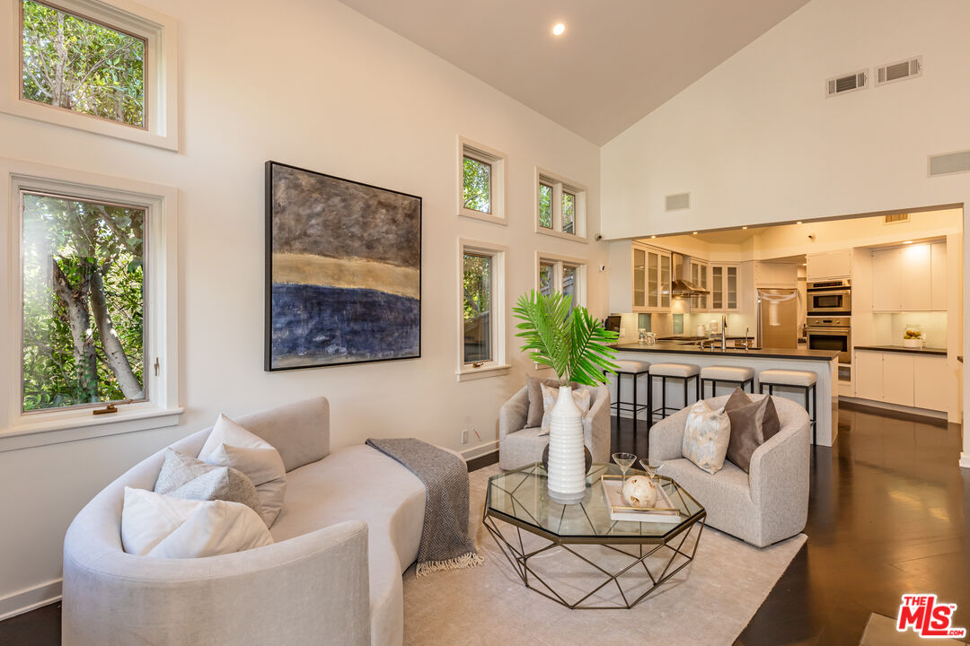 851 Glenmont Avenue Los Angeles, CA 90024 - Photo 7 of 26 a living room with furniture and a large window