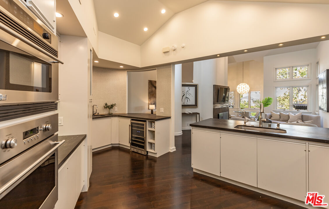 851 Glenmont Avenue Los Angeles, CA 90024 - Photo 10 of 26 a kitchen with stainless steel appliances a sink stove and refrigerator