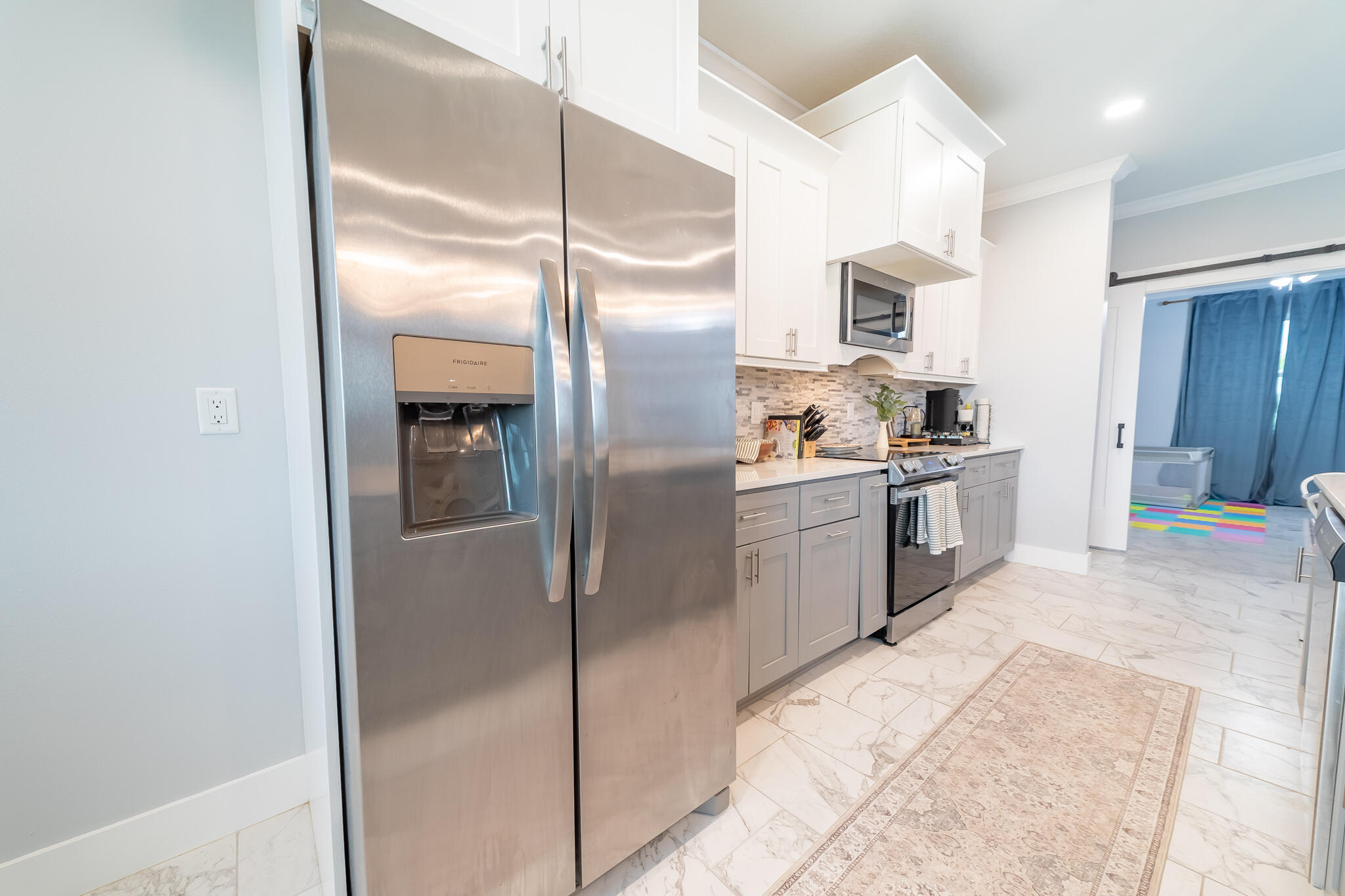8640 Southwest 7th Lane Okeechobee, FL 34974 - Photo 13 of 52 a kitchen with stainless steel appliances granite countertop a refrigerator and a sink
