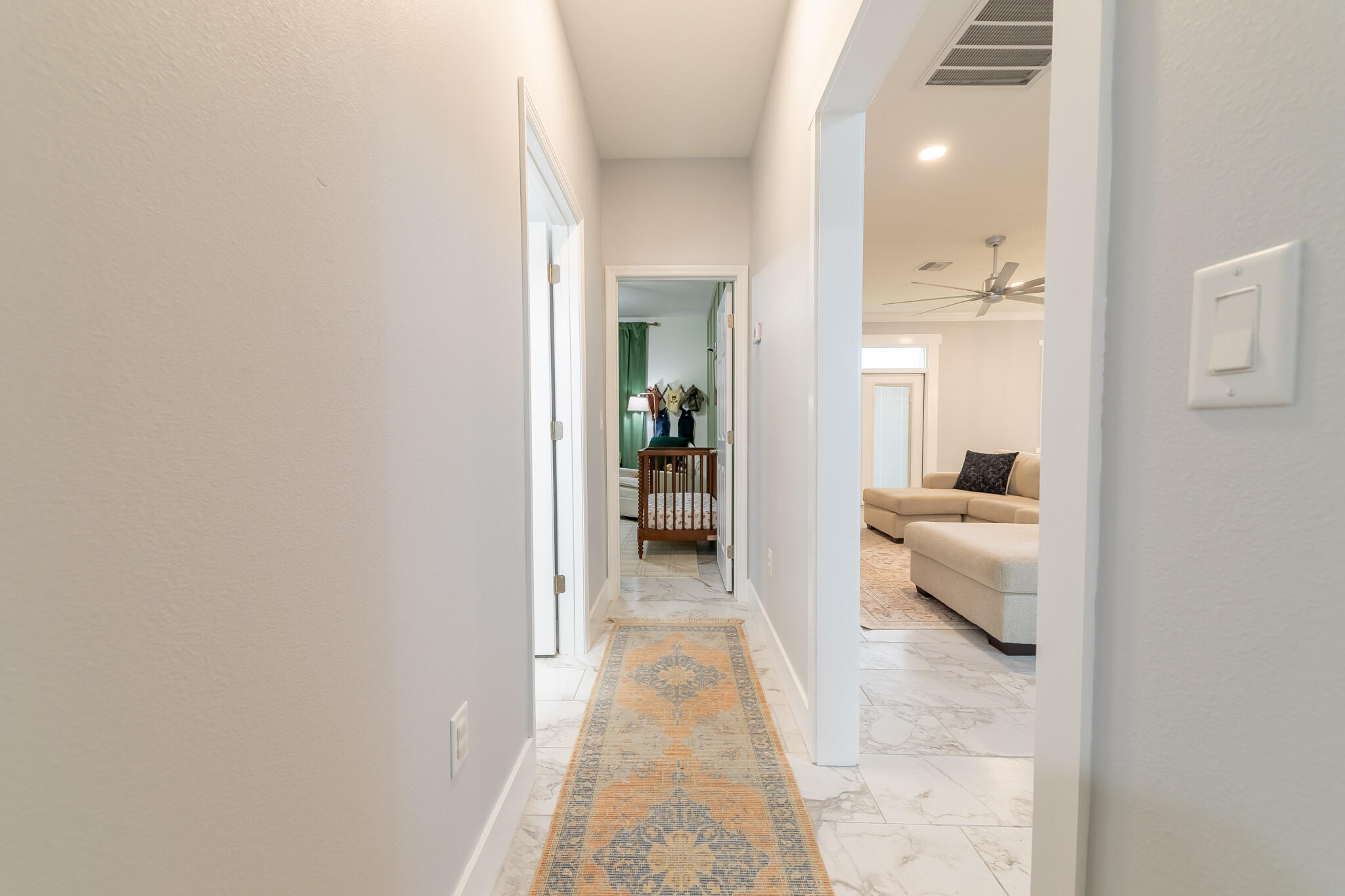8640 Southwest 7th Lane Okeechobee, FL 34974 - Photo 16 of 52 a view of a hallway with wooden floor a bedroom and a bed