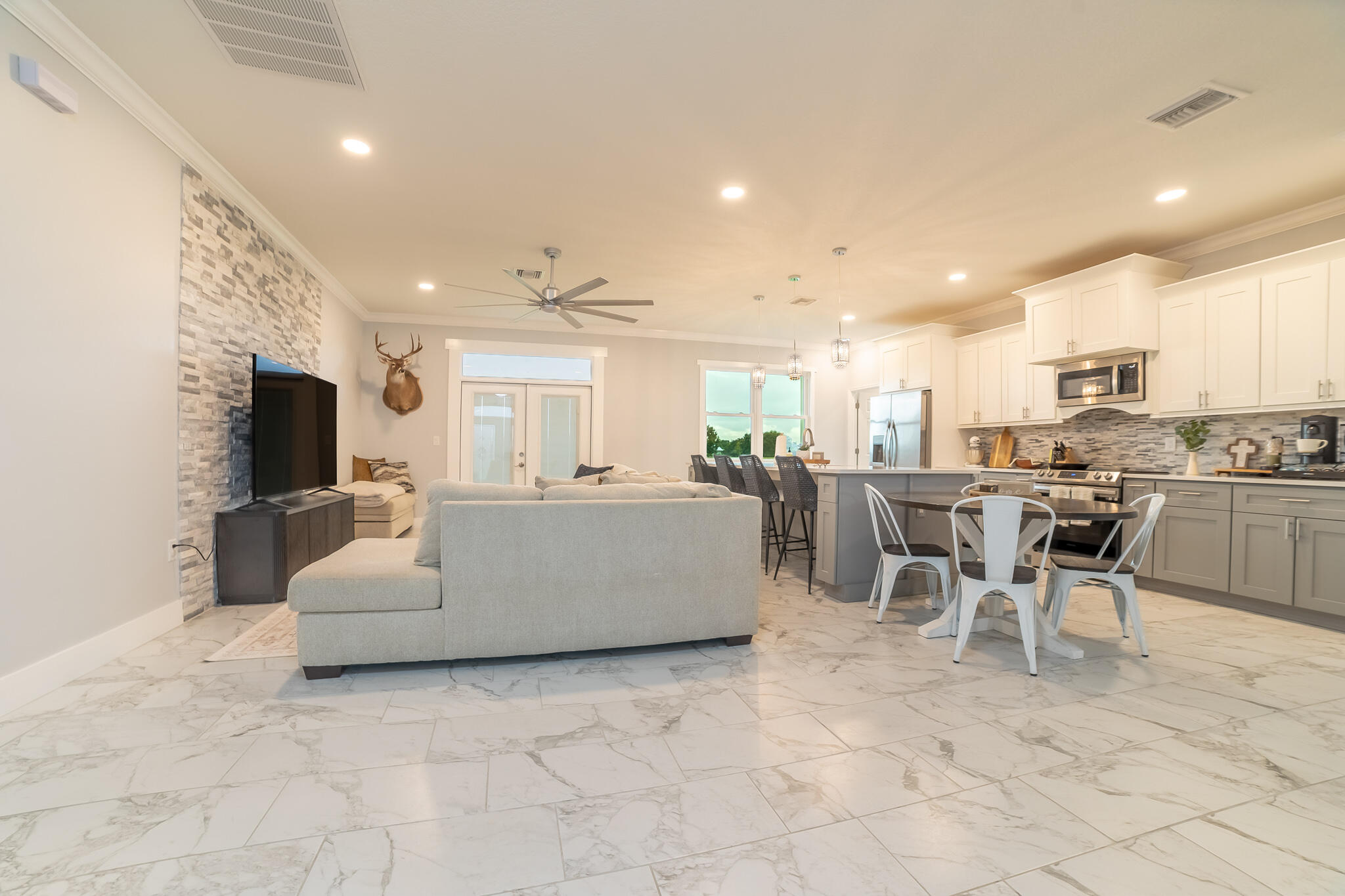8640 Southwest 7th Lane Okeechobee, FL 34974 - Photo 3 of 52 a living room with furniture and a flat screen tv