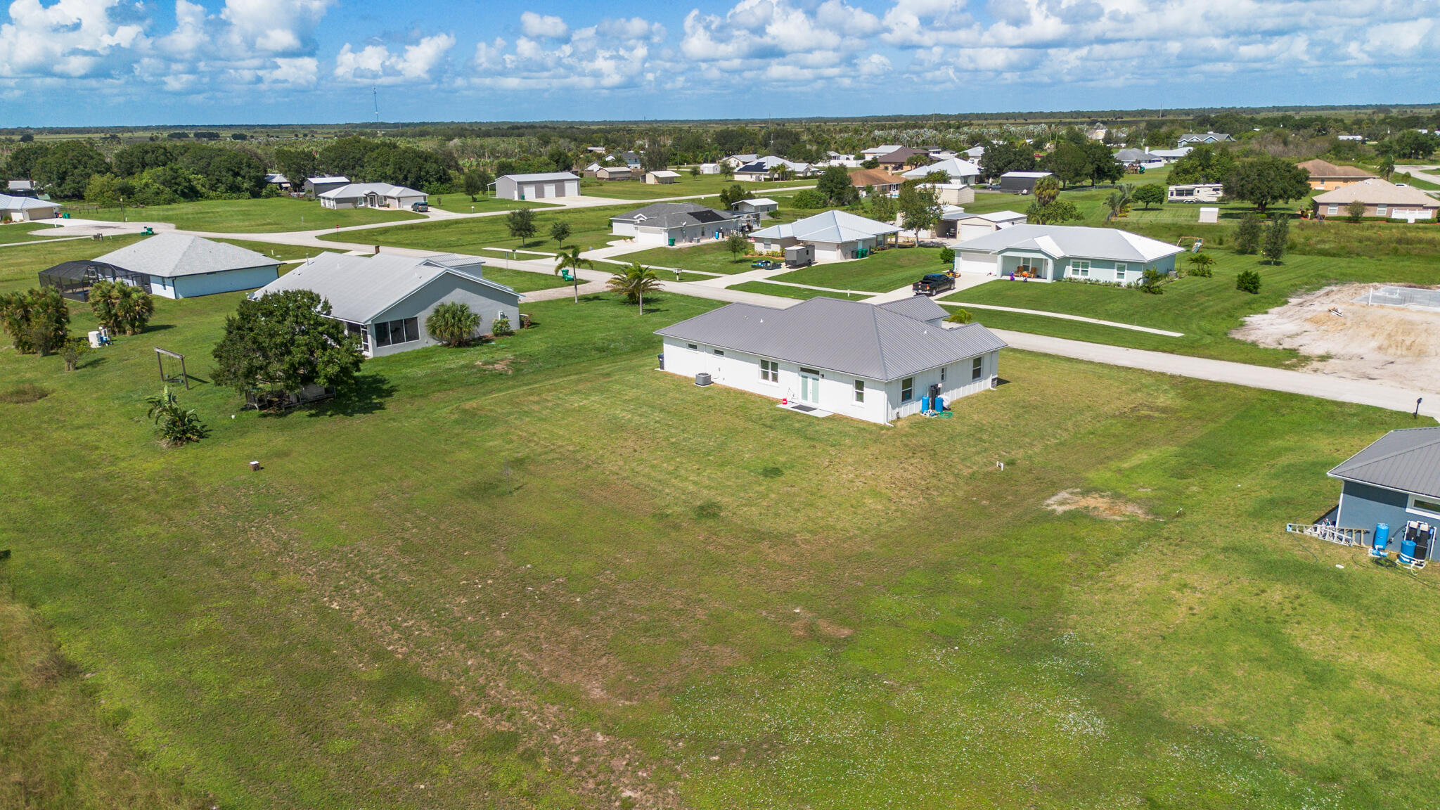 8640 Southwest 7th Lane Okeechobee, FL 34974 - Photo 49 of 52 an aerial view of residential houses with outdoor space
