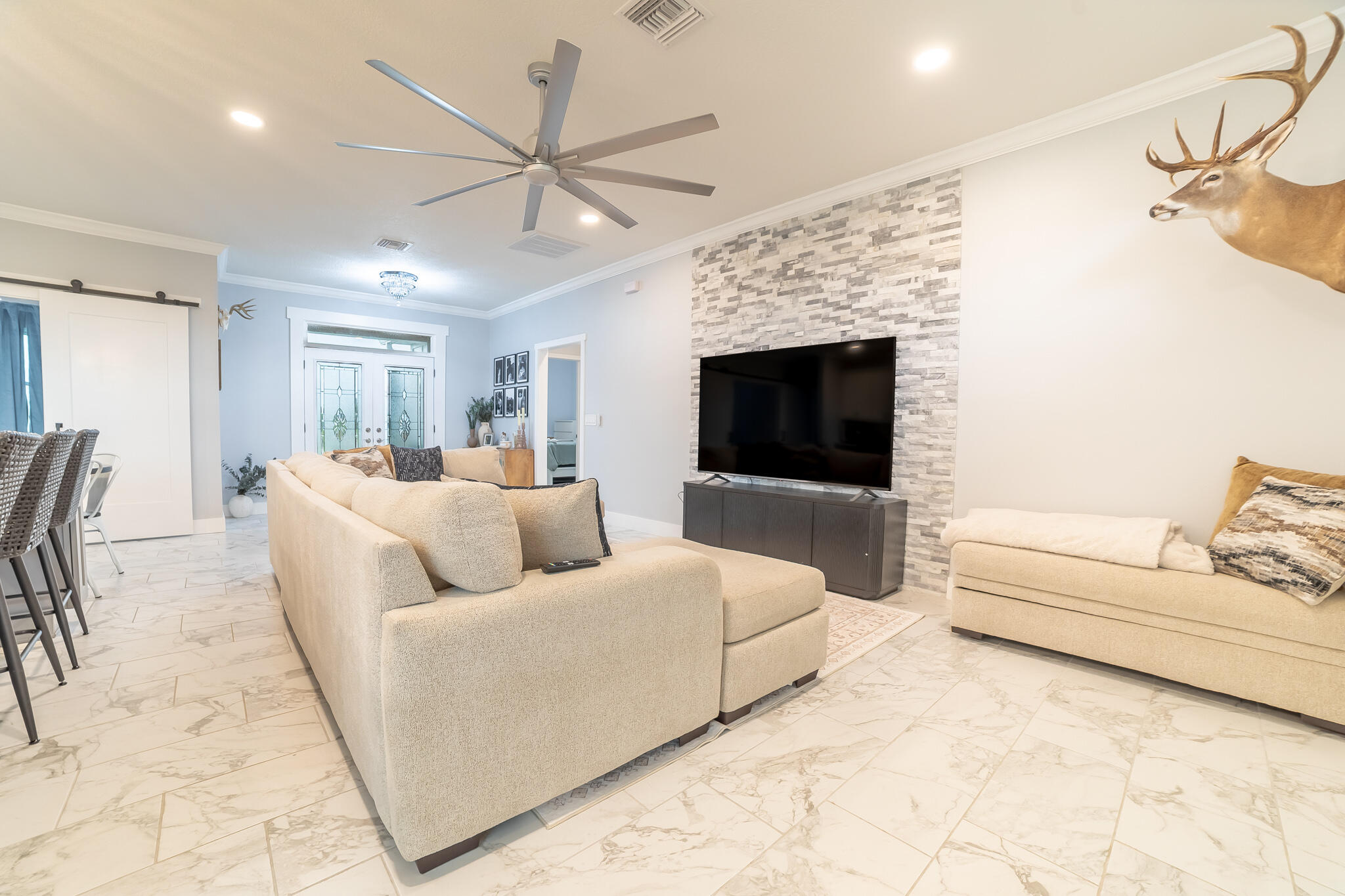8640 Southwest 7th Lane Okeechobee, FL 34974 - Photo 5 of 52 a living room with furniture and a fireplace