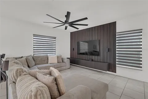 a living room with furniture and a window