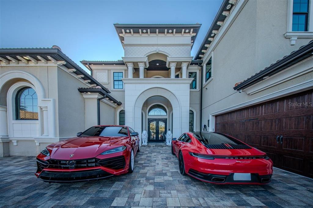 4303 Isabella Circle Windermere, FL 34786 - Photo 11 of 77 a living room with furniture a fireplace and chandelier