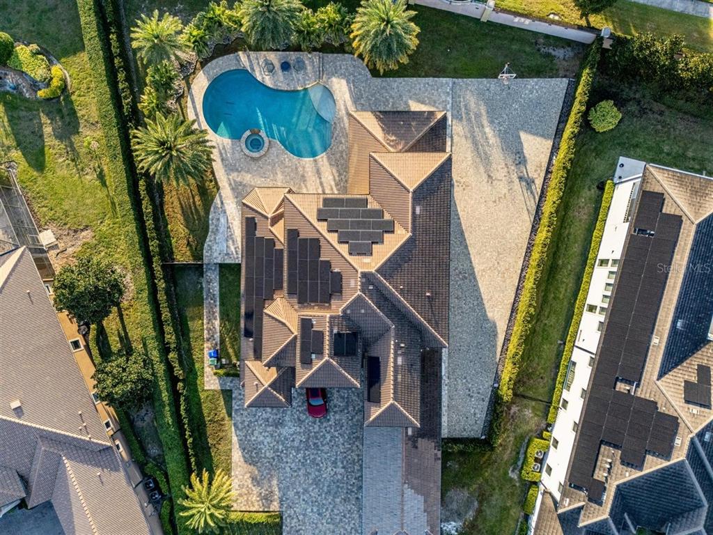 4303 Isabella Circle Windermere, FL 34786 - Photo 22 of 77 an aerial view of multiple houses with yard