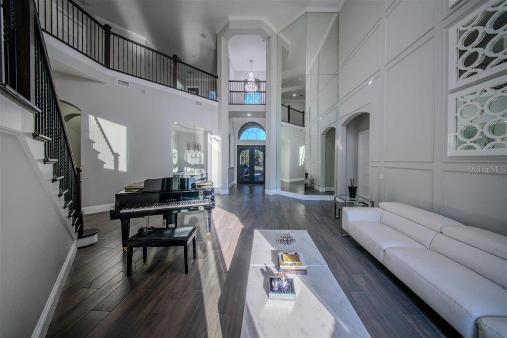 4303 Isabella Circle Windermere, FL 34786 - Photo 23 of 77 a living room with furniture fireplace and dining table