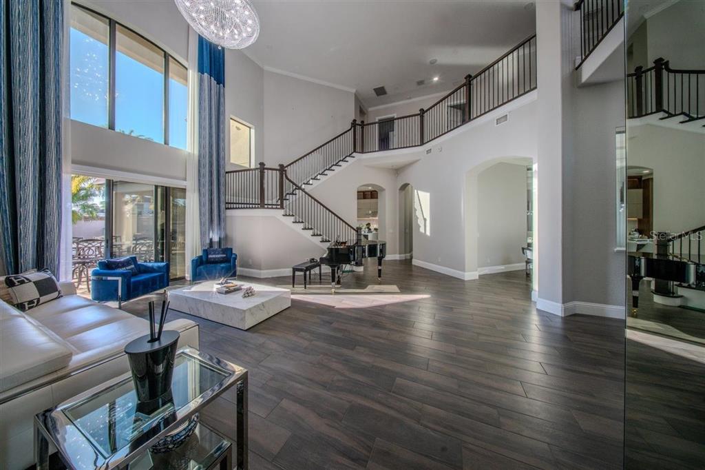 4303 Isabella Circle Windermere, FL 34786 - Photo 29 of 77 a view of a livingroom with furniture and a wooden floor
