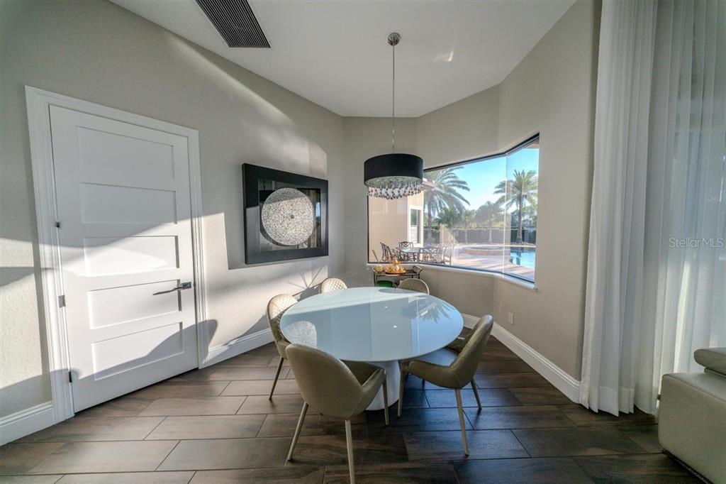 4303 Isabella Circle Windermere, FL 34786 - Photo 36 of 77 a dining room with furniture and window