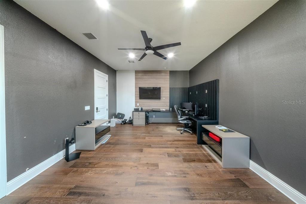 4303 Isabella Circle Windermere, FL 34786 - Photo 53 of 77 a view of a room with gym equipment and a window