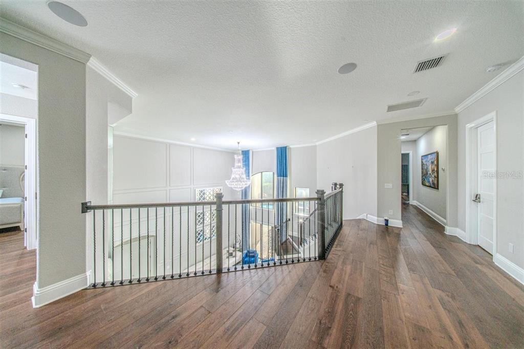 4303 Isabella Circle Windermere, FL 34786 - Photo 54 of 77 a view of a hallway with wooden floor
